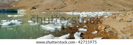 Panorama of glacier lake and ice under mountain edith cavell in august, jasper national park, alberta, canada