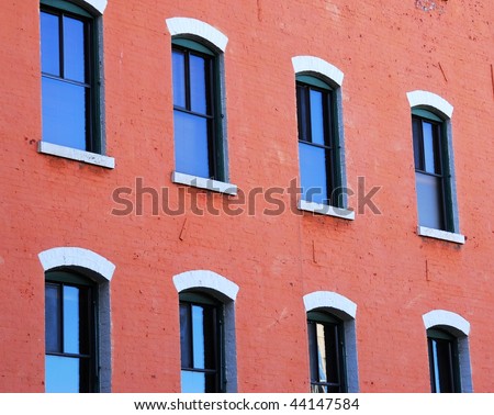 Windows of an old style office building in the downtown of victoria, british columbia, canada