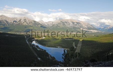 Bird view of the bow valley and mountains in lights and shadows in the sunset moment, banff national park, alberta, canada