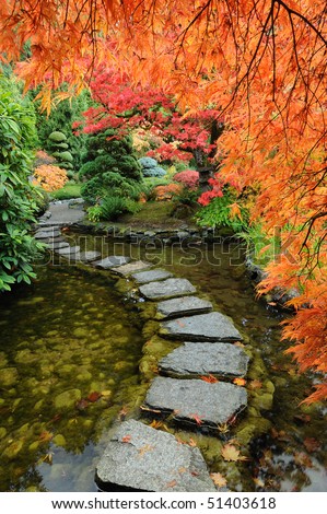 Pond and path of the japanese garden inside the famous historic butchart gardens (built in 1903), vancouver island, british columbia, canada