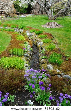 Creek and garden in the historic hatley castle (built in 1908) at the city colwood in vancouver island, british columbia, canada
