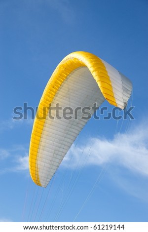 Parachute flying in the blue sky