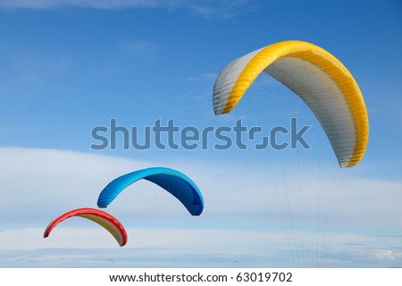 Parachute flying in the blue sky
