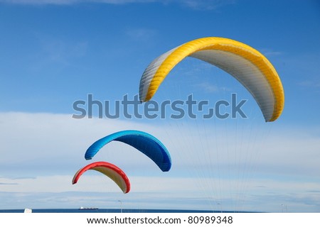 colorful Parachute flying in the blue sky