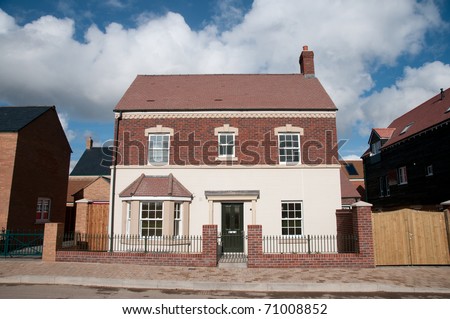 A traditional, double fronted house , England