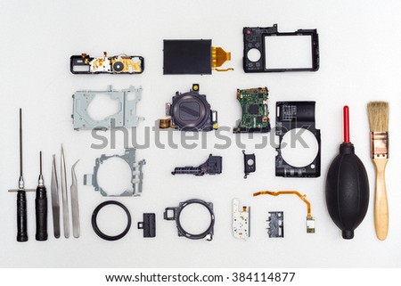 Mix all camera part on white background,Top view,Repair camera concept,Camera broken,Camera damage