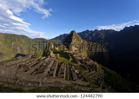 Early morning at the lost old Inca city  Machu Picchu in the Andes mountains in Peru. With a view at the Wayna Picchu mountain in the back.