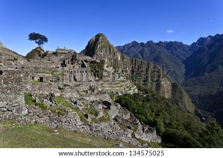 View at the lost Inca city Machu Picchu with the Huayna Picchu mountain in the back - Andes - Peru - South America