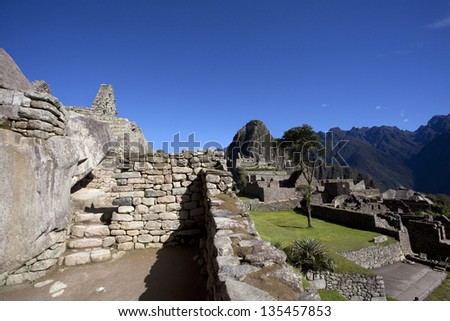 Ruins of the lost Inca city Machu Picchu, high up in the Andes mountains in Peru, South America