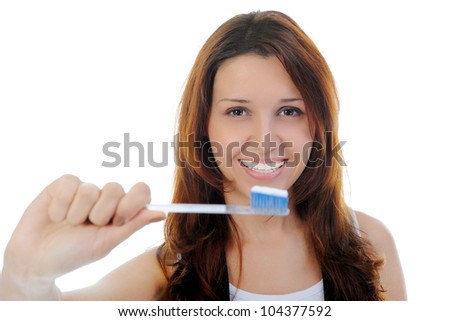Portrait of beautiful teen girl in braces. Isolated on a white background
