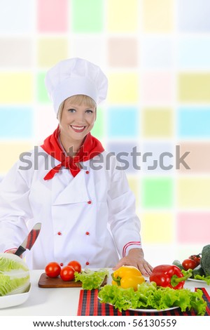 Happy Chef in uniforms preparing a healthy salad.