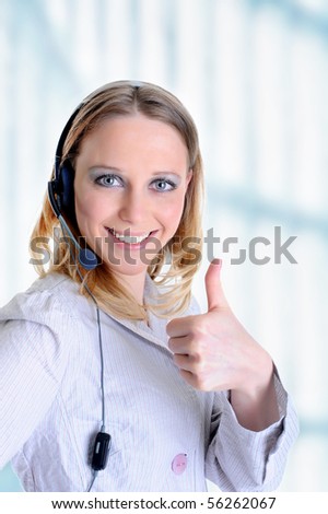 image: stock-photo-portrait-of-a-beautiful-girl-with-a-headset-in-the-office-56262067