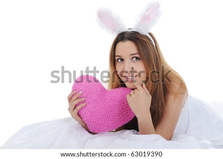 Smiling woman with rabbit ears with Heart. Isolated on white background