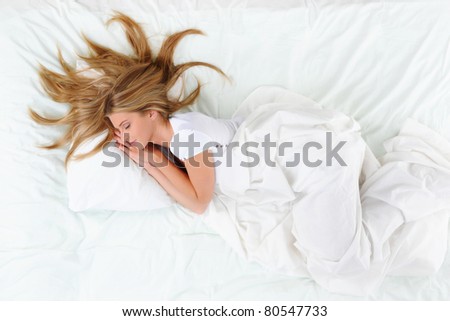 young beautiful blonde woman on the bed