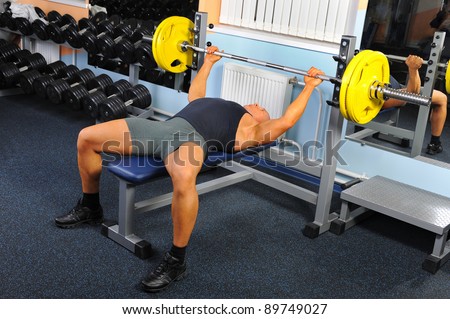 man trained in the gym Bar Bench Press