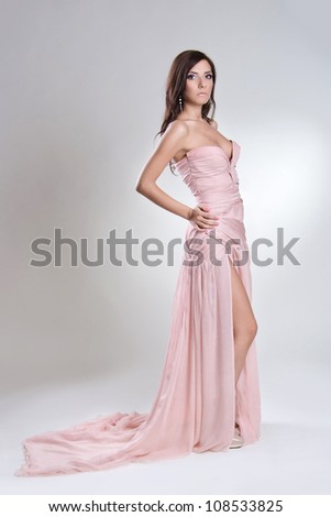 http://image.shutterstock.com/display_pic_with_logo/378590/108533825/stock-photo-beautiful-young-woman-in-long-dress-108533825.jpg