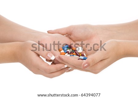 many different medications, pills in two hands of two young girls. Medicine