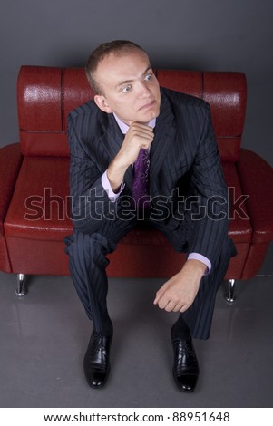 young guy in a suit waiting for their turn to be interviewed