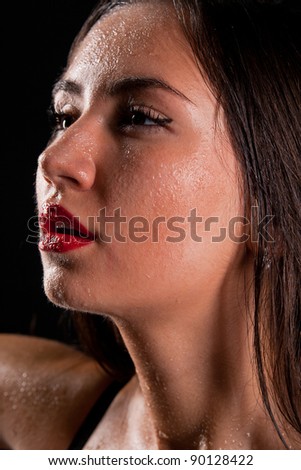 stock photo Young beautiful girl naked isolated on a black background