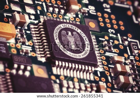 MARCH 16, 2015: Illustration of a spying CPU inside a computer with the NSA logo on it.