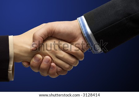 Hand shake - hand shake in front of a blue background