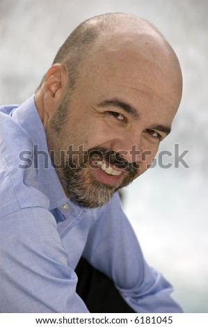 Middle aged man smiling - balding, middle aged man smiling