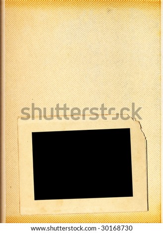 Blank page of a vintage photo album with one photo frame