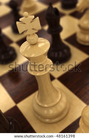 White chess king on chess board - very shallow depth of field with focus on the top of the king