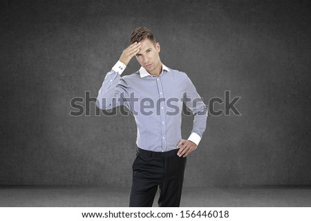 young handsome confused businessman