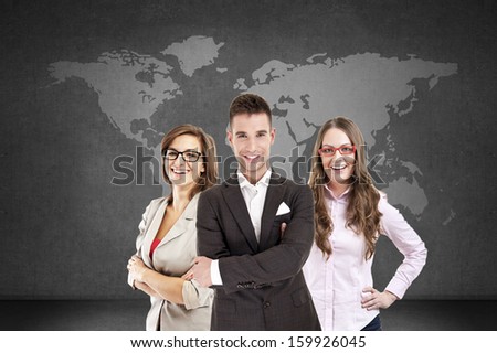 People on black with a map of the world behind them, good for worldwide and global business themes.
