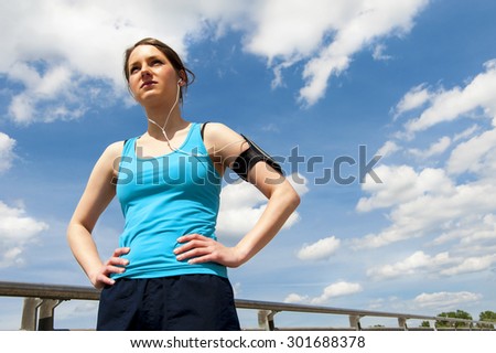 Young woman rest after run, jogging fit in the city.