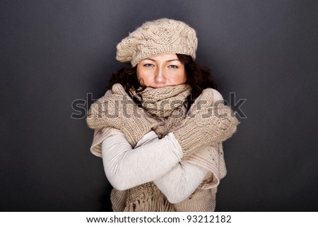 woman smiling with hat and gloves on her