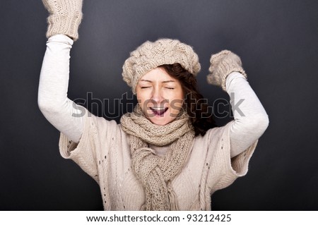 woman smiling with hat and gloves on her