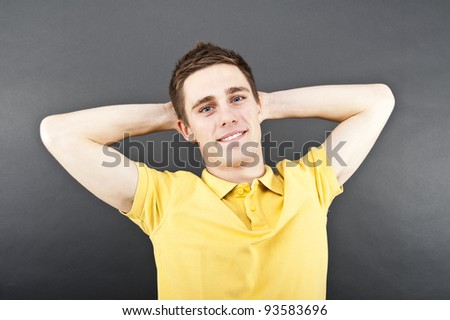 man on black background in polo shirt