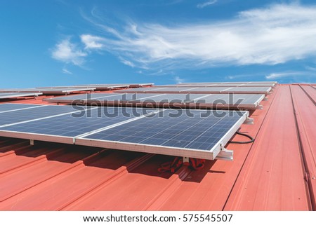 Solar panel pattern on red roof tile.Solar power.