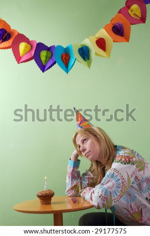 a woman sad because are alone in her birthday party
