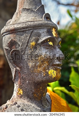 ancient statue face in thailand