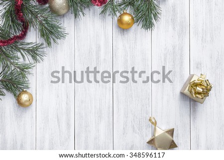 Christmas white wooden background top view. Template for New Year space for text. Mockup for advertising, congratulations. Holiday Greeting Cards Design. Christmas wooden background with fir branches