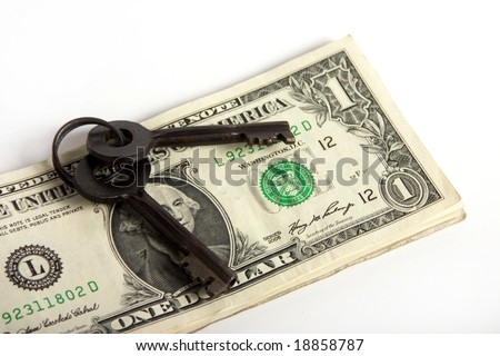Keys on a stack of cash