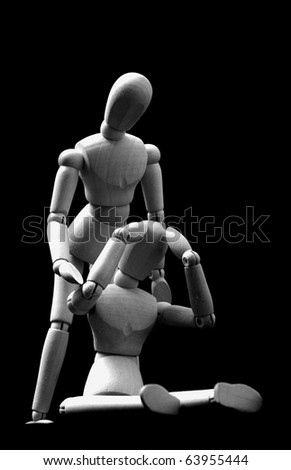 wooden models dolls in a sad pose in black and white