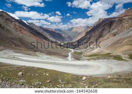 Twisting road going to Barskoon pass in Kirghizia