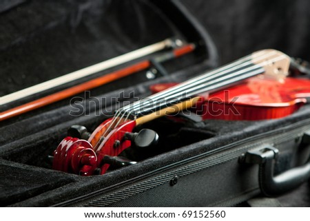 Violin and bow in dark black case