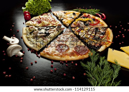 six slices of pizza with different toppings on a black background