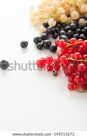 Berries ripe blueberries, red and white currants on a white background