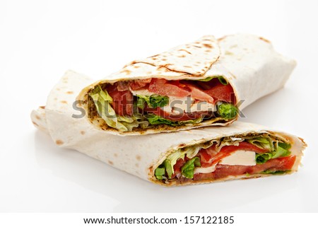 pita bread stuffed with meat, cheese, tomatoes, green salad on white background