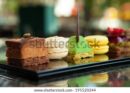 Gorgeous view of different cakes and biscuits, served in outdoors