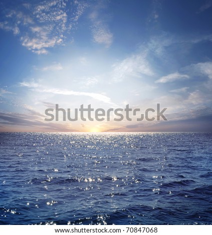 rising sun on the horizon, blue sea, ocean