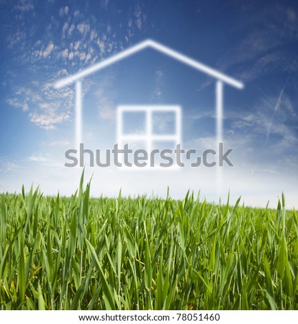 Project home on fresh, young, green grass and blue sky with white clouds
