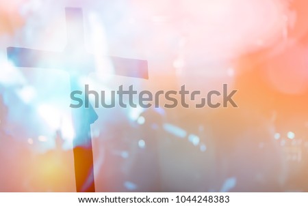 Blurred photo of Silhouette cross of Crucifixion Of Jesus Christ.Concept for faith religion, christian worship, Easter, Redeemer Thanksgiving and praise.Worship concert background for Good friday