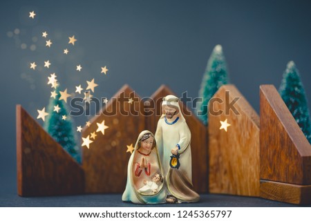 Christmas nativity scene of born child baby Jesus Christ in the manger with Joseph and Mary.Traditional Christmas Nativity Scene of baby Jesus in the manger with Mary and Joseph.